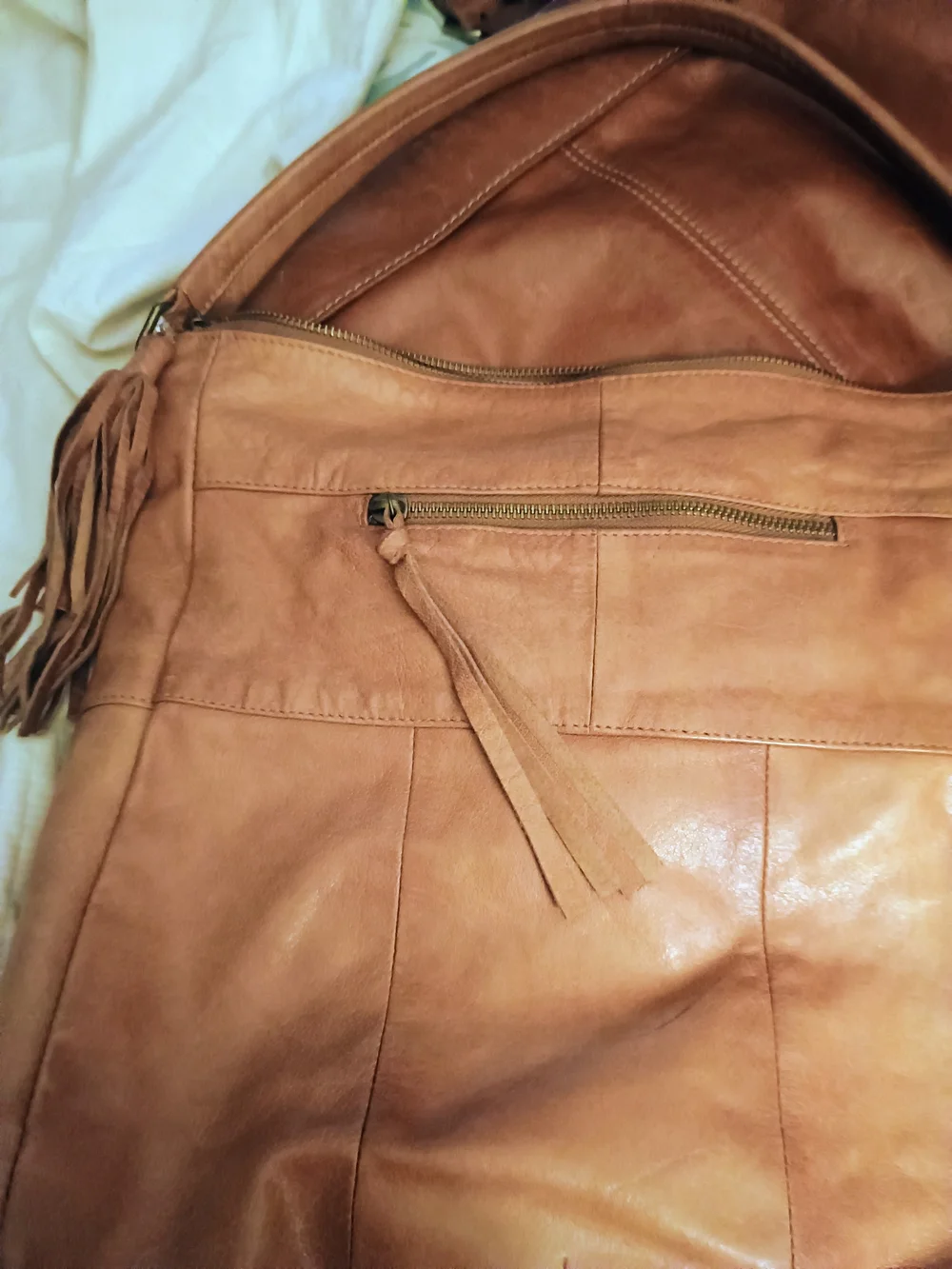 ANTHROPOLOGIE!! LEATHER TAN W/TASSELS!! 14 IN X 14 IN
